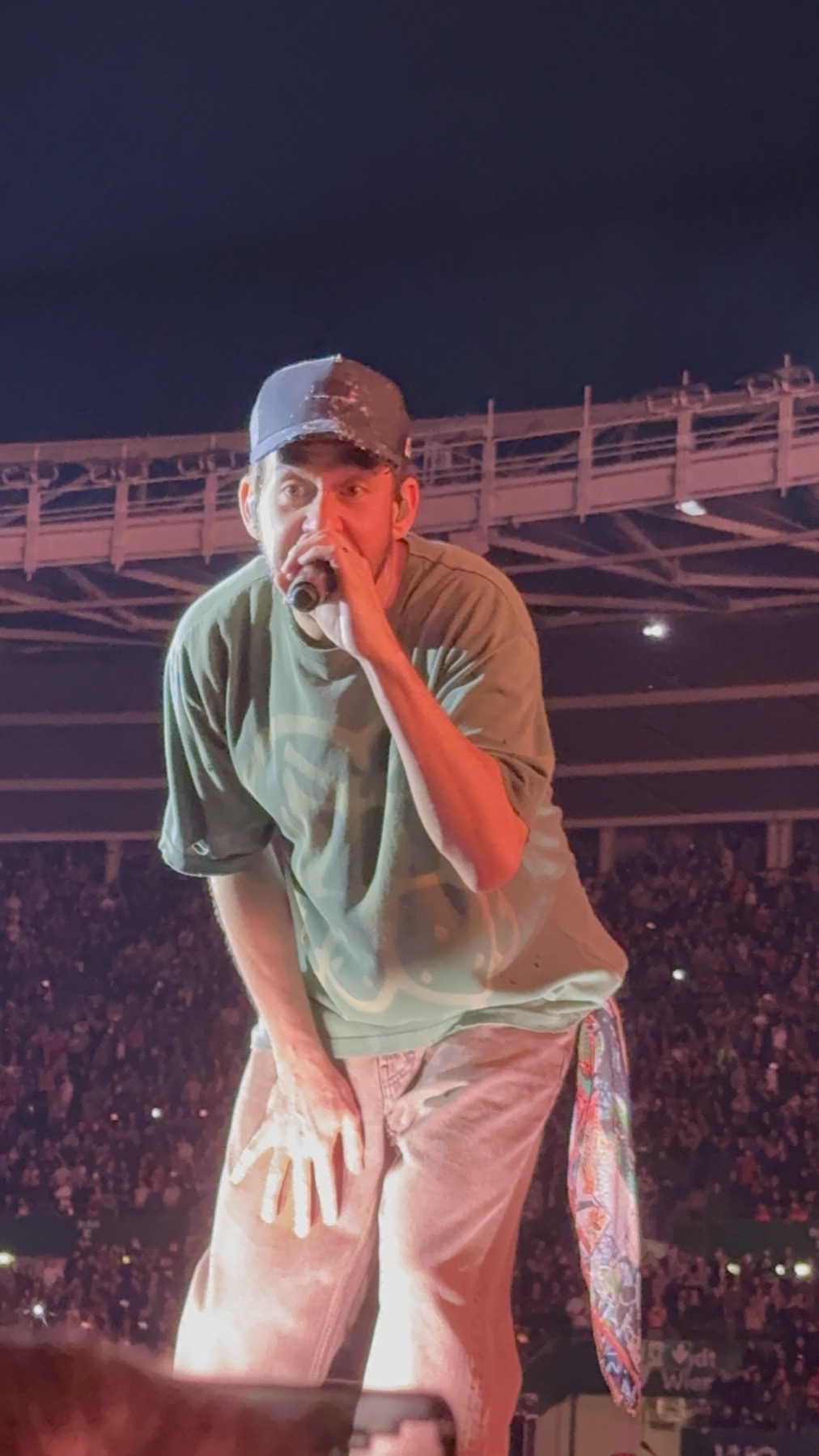 Mike Shinoda leaning over the Linkin Park catwalk at Ernst Happel Stadion in Vienna