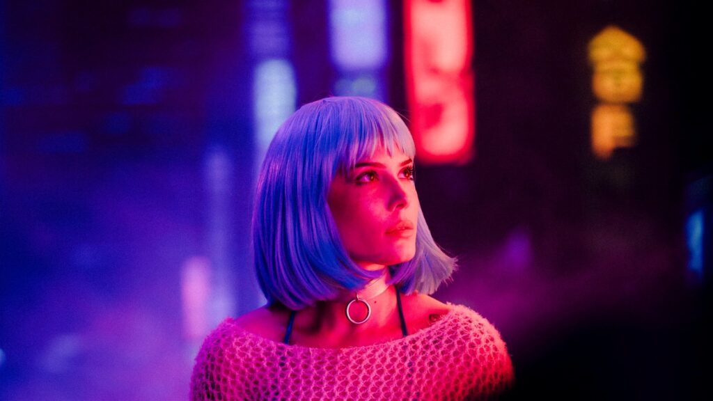 Halsey in neon lighting with Badlands-era styling